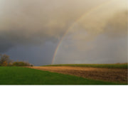 Akker met regenboog