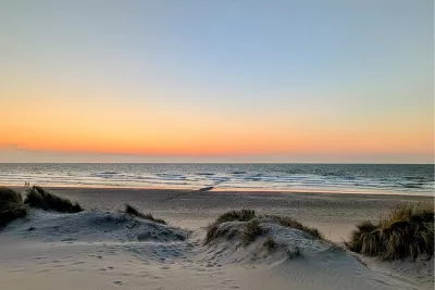 Zonsondergang in de duinen, de foto